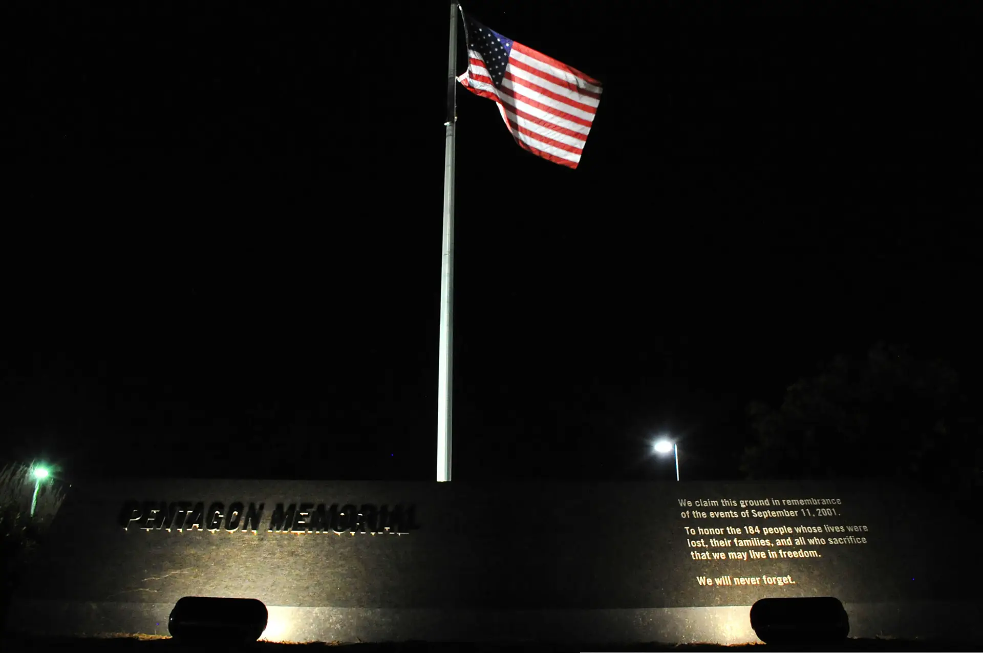 U.S. flag illuminated at the National 9/11 Pentagon Memorial in Arlington, Virginia